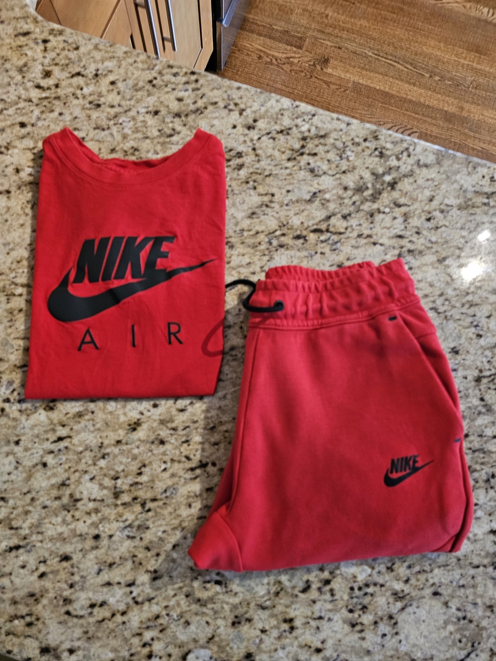 Nike boys/youth 2-piece set in red and black, both Youth Size Large.